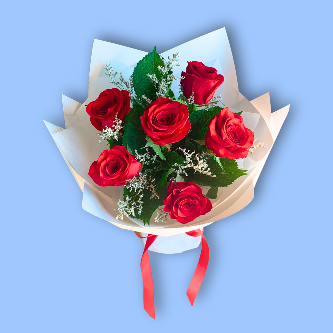 6 Red Roses wrapped in white in 360 degree round style. red satin bow. in waterbox