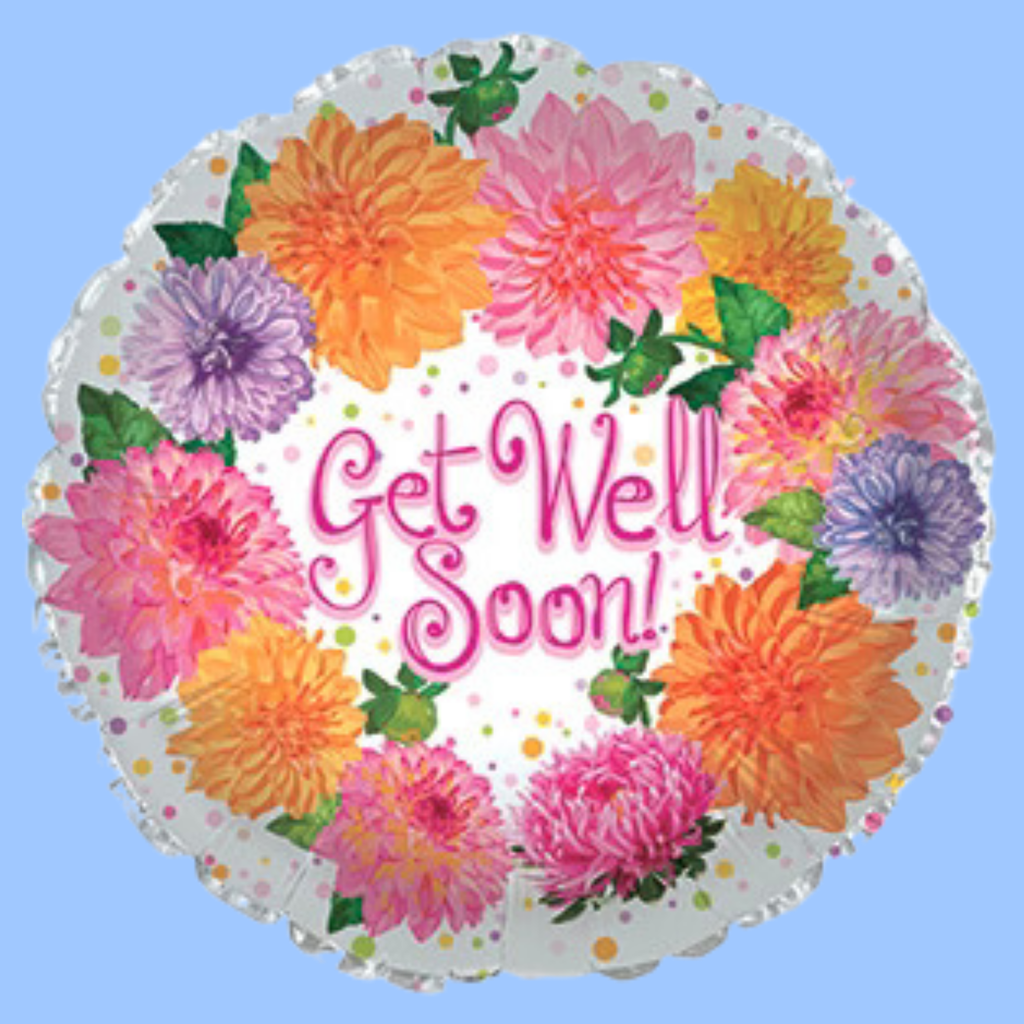 A round foil balloon with a scalloped edge, decorated with a colorful border of pink, orange, purple, and yellow flowers and green leaves. The center features the words 'Get Well Soon!' in pink cursive text on a white background with small multicolored polka dots.