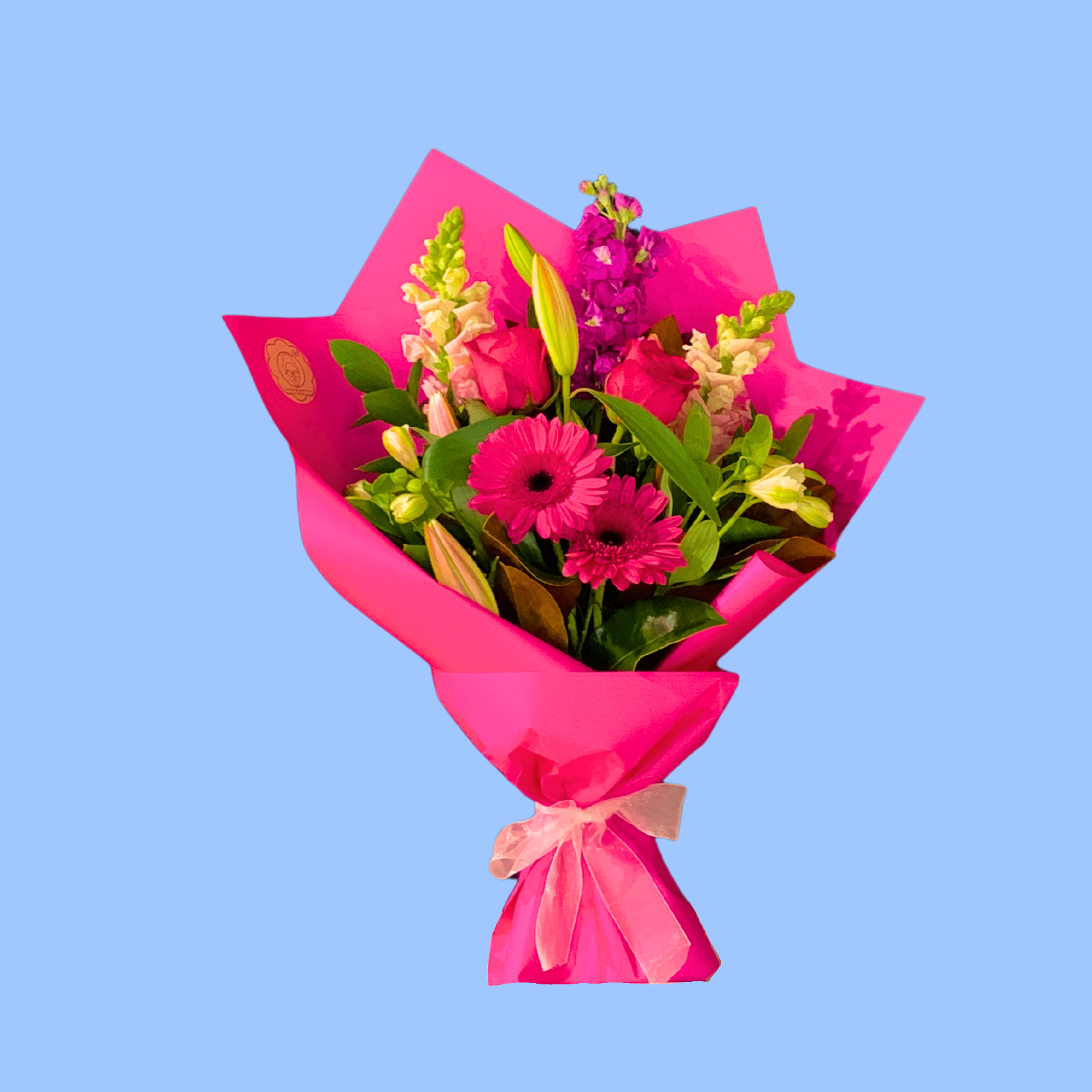 Bouquet of bold pink flowers wrapped in hot pink with a pink bow.