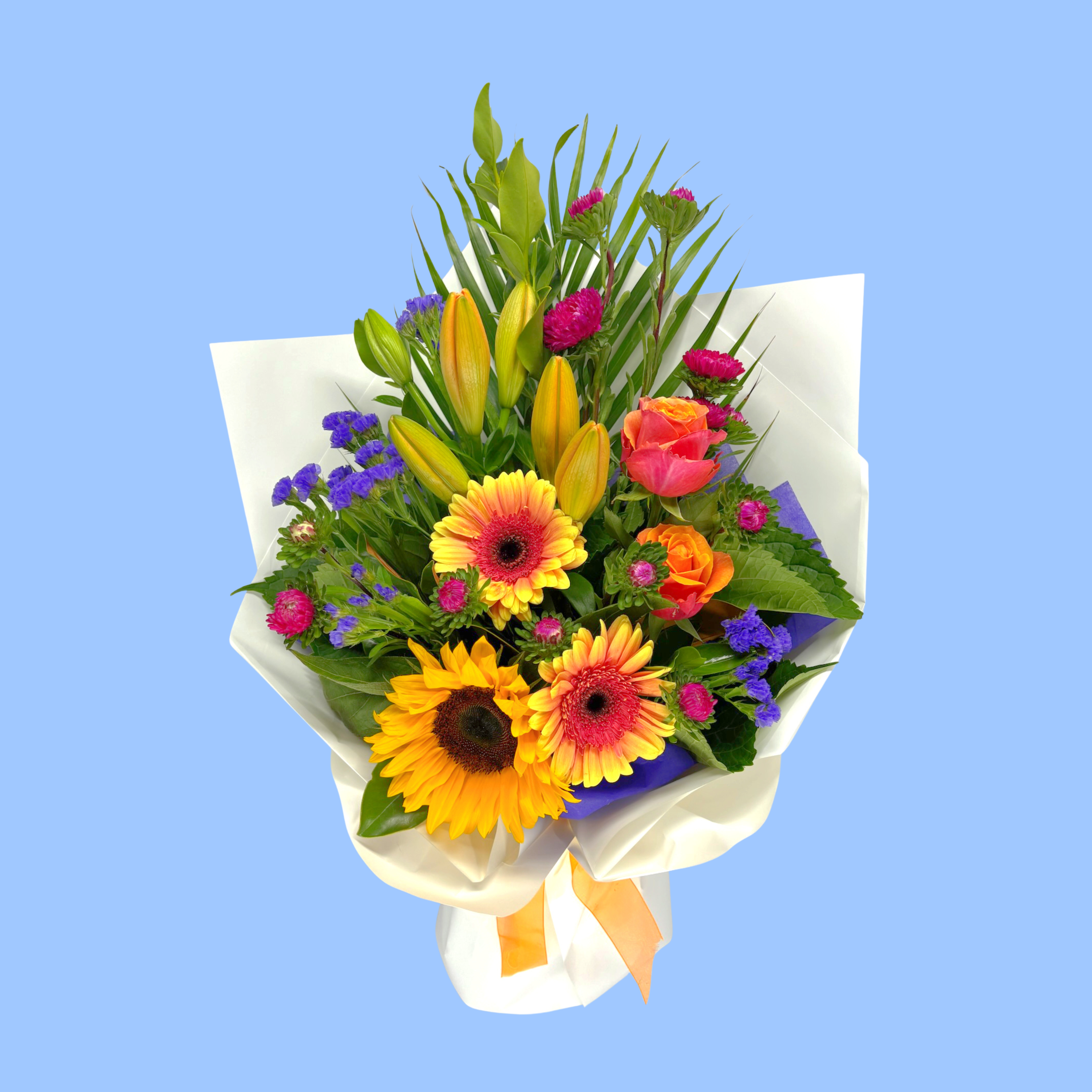 Mixed Bouquet of vibrant coloured flowers wrapped in craft and white with vibrant pink bow.