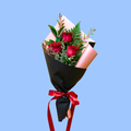 Elegant 3 red rose bouquet, wrapped in black and rose gold, with trailing satin ribbon
