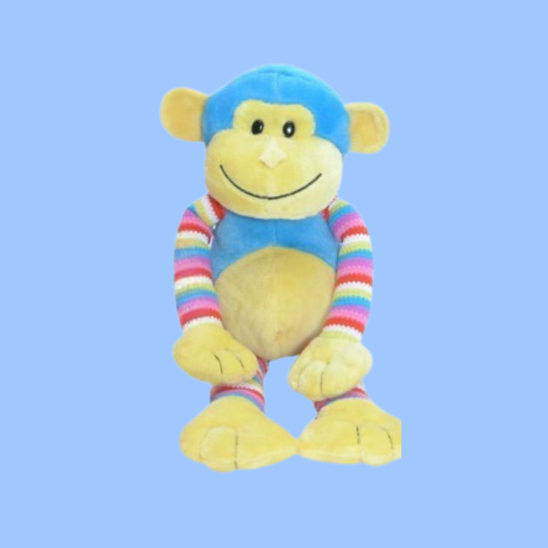 A plush smiling monkey toy with a yellow belly, blue head & Torso , and rainbow-striped arms and legs, centered on a solid light blue background.