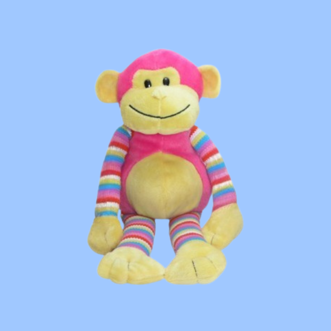 A plush smiling monkey toy with a yellow face and belly, pink head and torso, and multicolored striped arms and legs, centered on a light blue background.