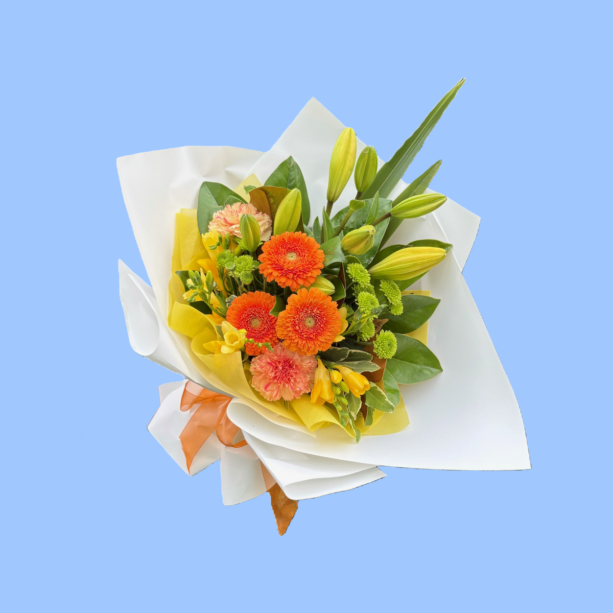 Orange and yellow flower bouquet with green foliage, wrapped in white with yellow vilene and orange bow
