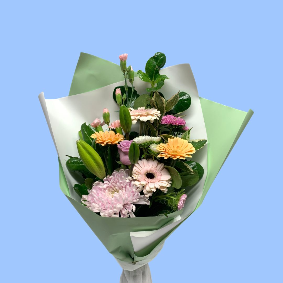 Pastel coloured flower bouquet in sage and white wrap