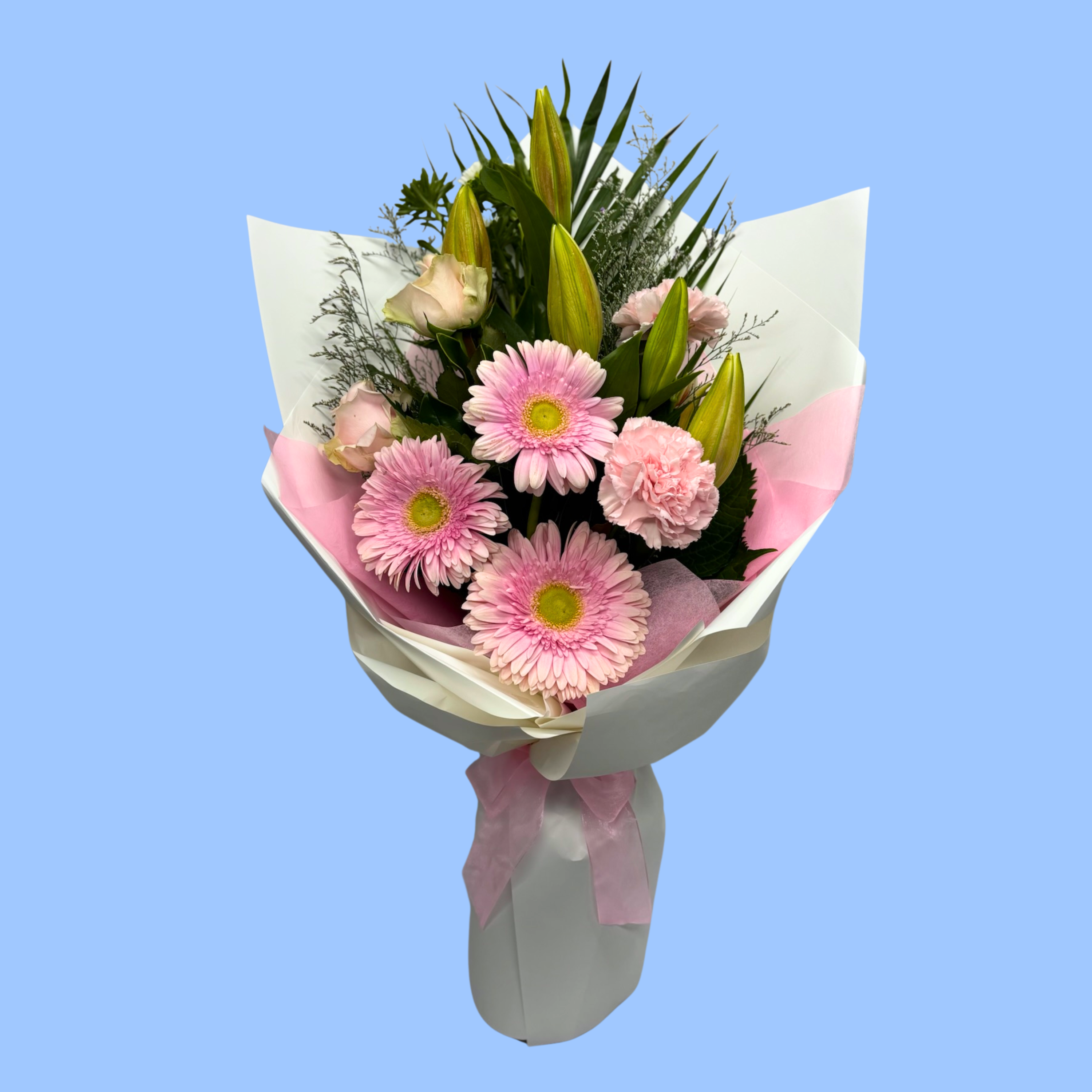 Soft Pink flower bouquet wrapped in white with pink vilene and bow.