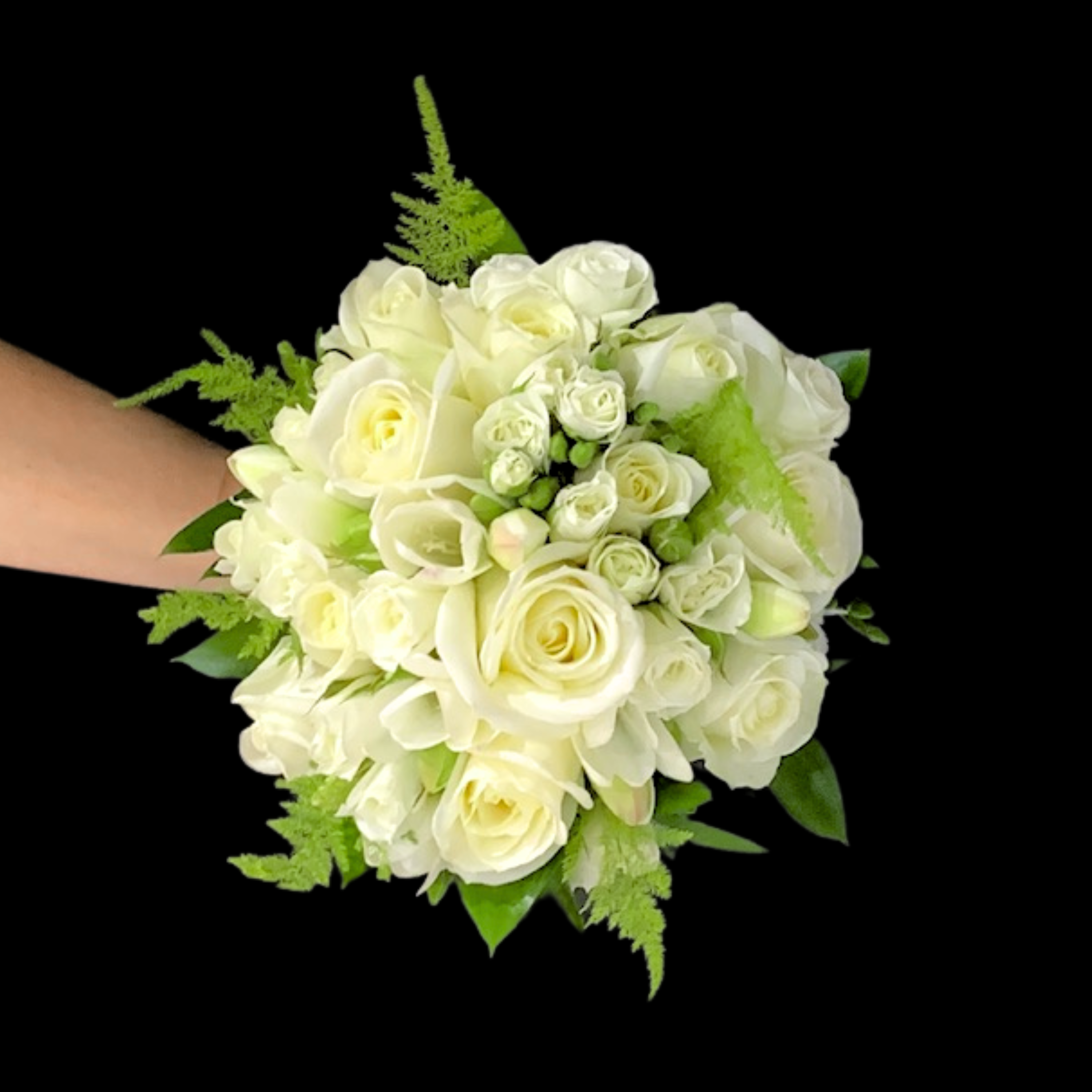 Top down view of Traditional brides bouquet of tightly arranged white and cream flowers in round 360 degree style.