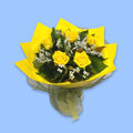 6 Yellow roses in greenery wrapped in yellow in a 360 degree round style. In a white waterbox with black netting surrounding the base.
