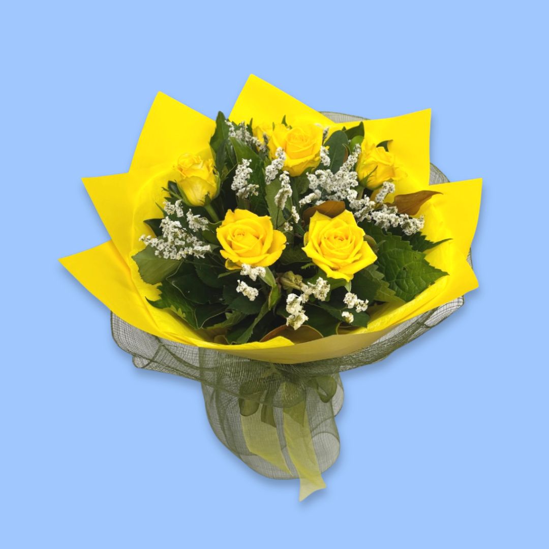 6 Yellow roses in greenery wrapped in yellow in a 360 degree round style. In a white waterbox with black netting surrounding the base.