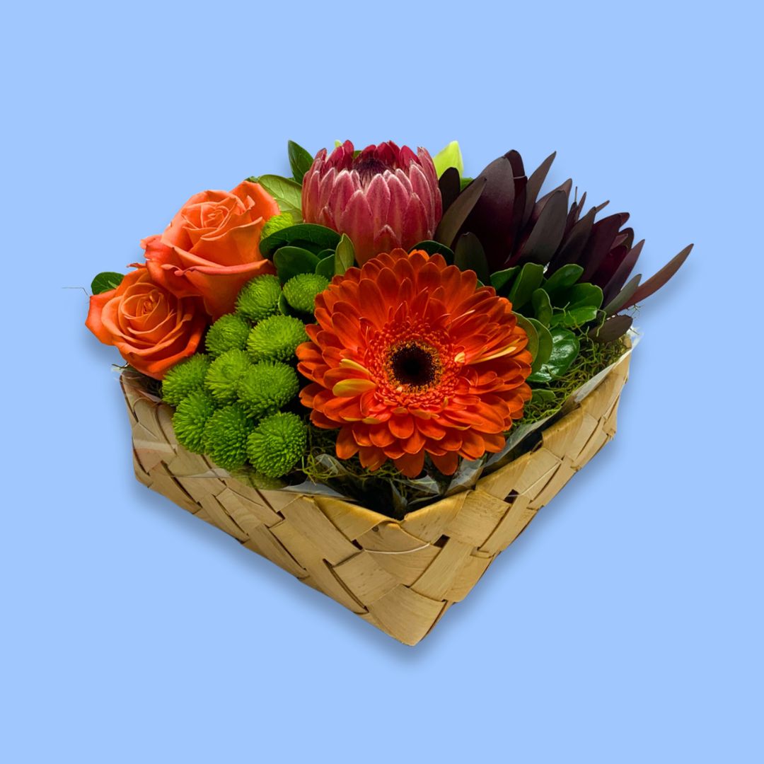Floral arrangement in a woven basket 